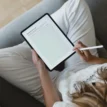 flatlay of woman sitting with ipad featuring journal page from the right fit relationship needs workbook.