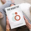 woman sitting the right fit workbook in lap