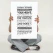 Person sitting cross legged holding the Thriving Good Life Manifesto Poster — bold black-and-white motivational wall art about self-management and accountability.
